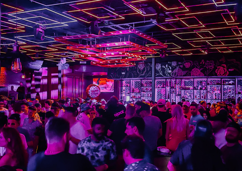 View of the Mayfair Night Club in Austin of the cool lighting and lots of people talking.