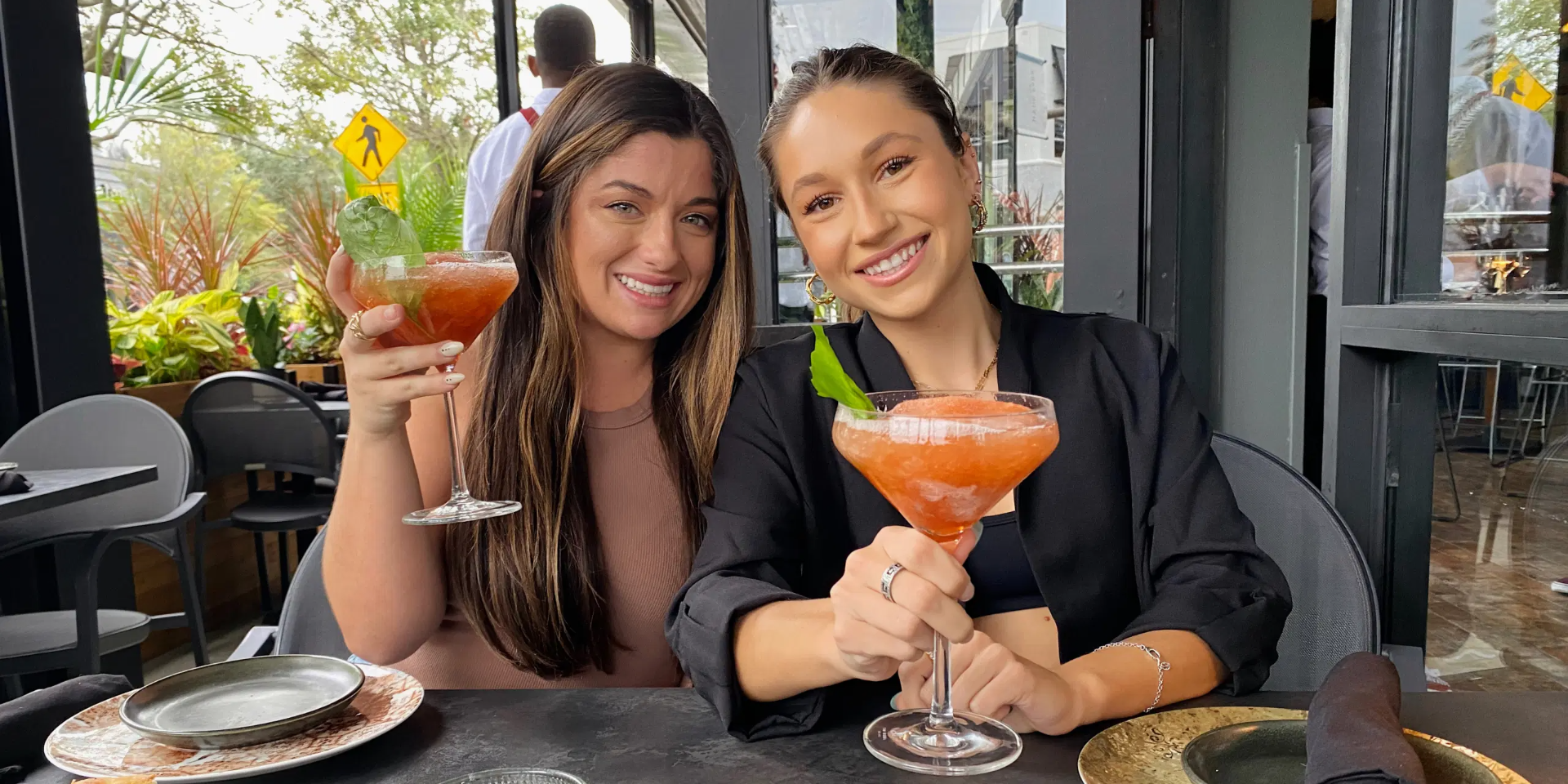 girls with drinks outdoors